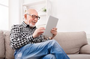 Man reading a tablet 