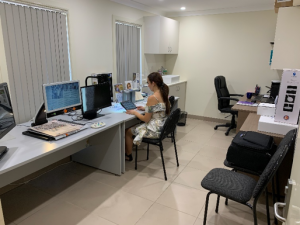 Lady sitting at desk in new office
